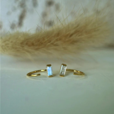 NATURAL BAGUETTE MOONSTONE OPEN GOLD HUGGIE EARRINGS Profile Picture